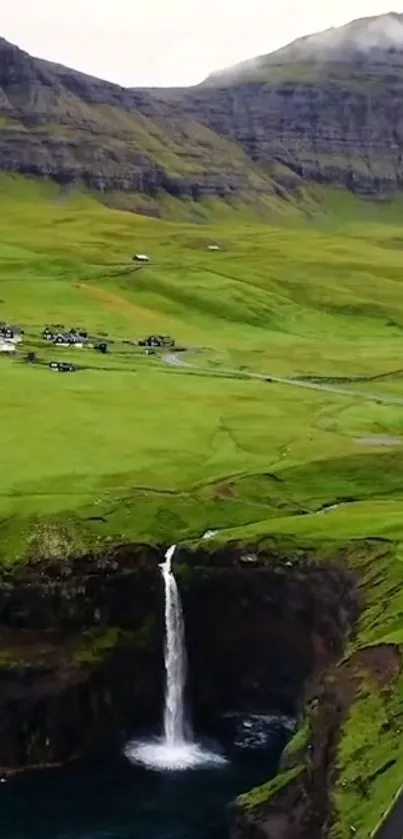 Lush valley with waterfall and mountains, perfect mobile wallpaper.