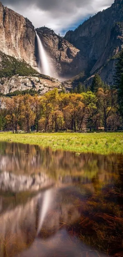 Breathtaking waterfall amidst mountain scenery with tranquil reflections.