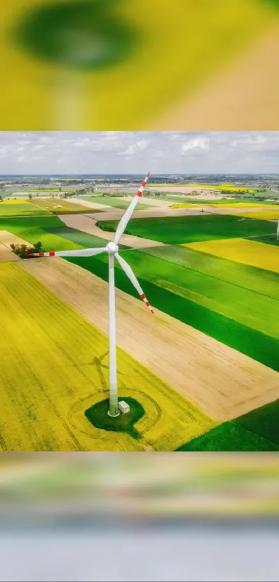 Aerial view of wind turbine in lush green fields.