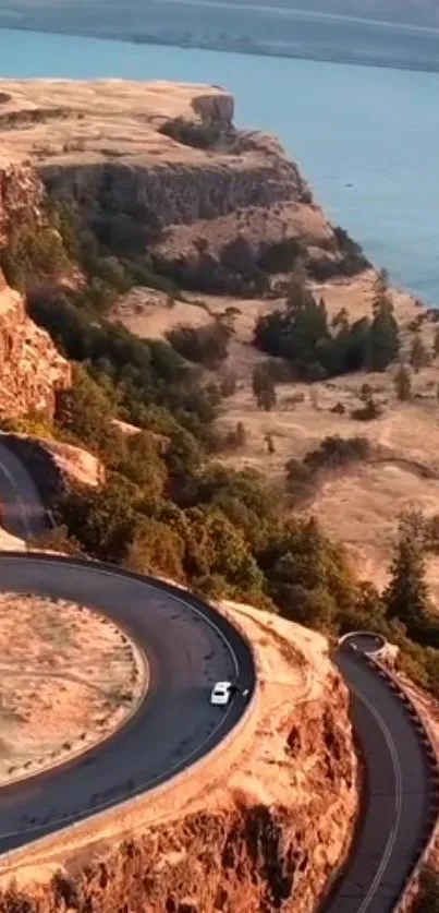 Winding road along cliffs with coastal view.