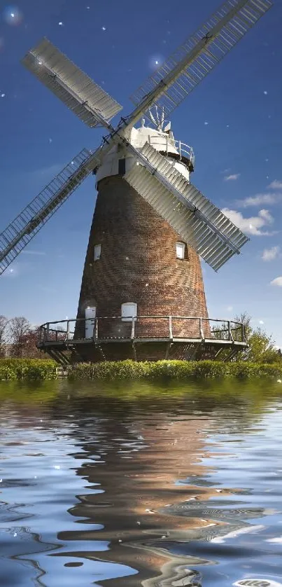 Windmill reflection in tranquil waters under a bright blue sky.