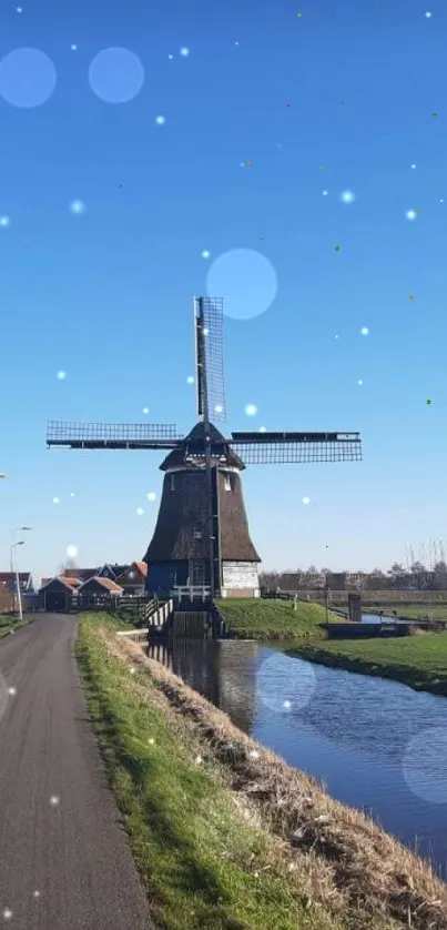 Scenic windmill under a blue sky with a rural landscape view.