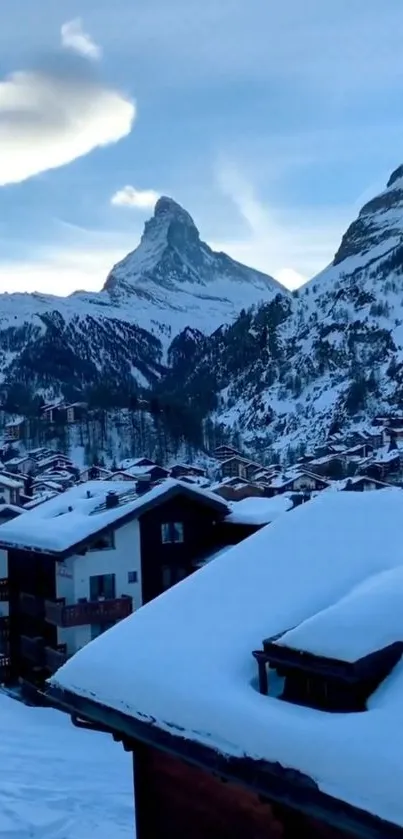 Snowy mountain village with blue sky and scenic winter landscape.