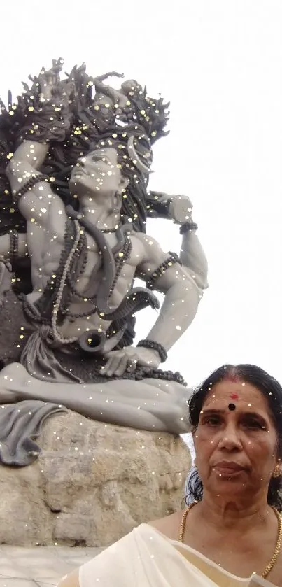 Serene sculpture with two people in foreground, expressing tranquility.