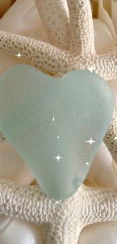 Teal heart-shaped sea glass on starfish and shells.