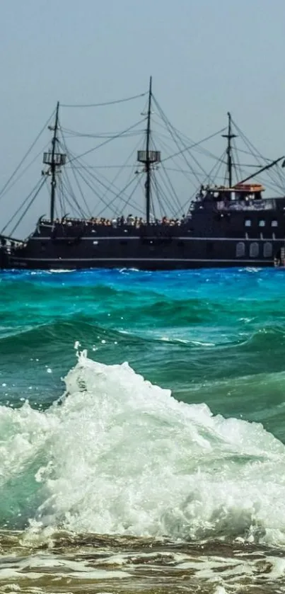 Pirate ship sailing on a turquoise sea with ocean waves.