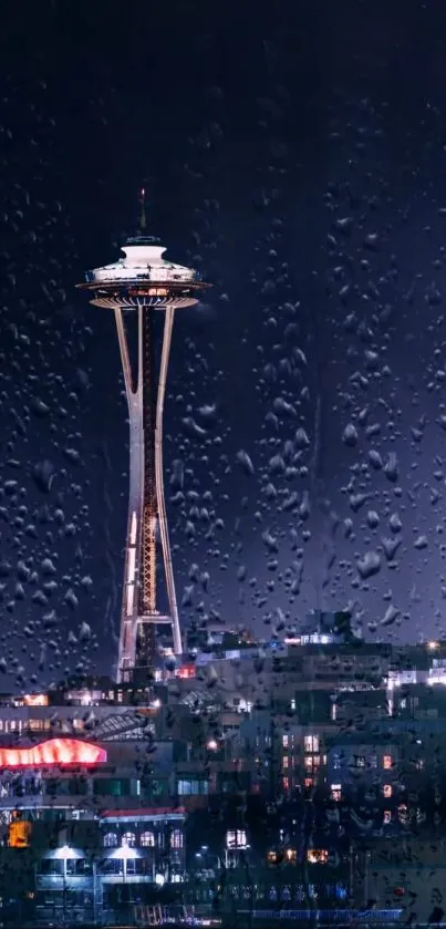 Seattle skyline at night with raindrops on a window.