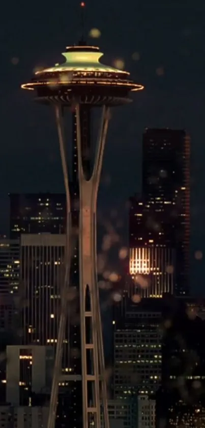 Seattle Space Needle glowing at night against a dark city skyline.