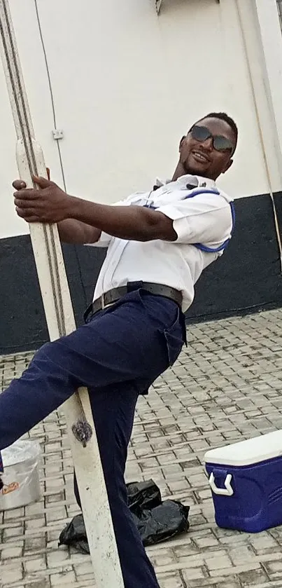 Joyful security guard posing playfully outdoors.