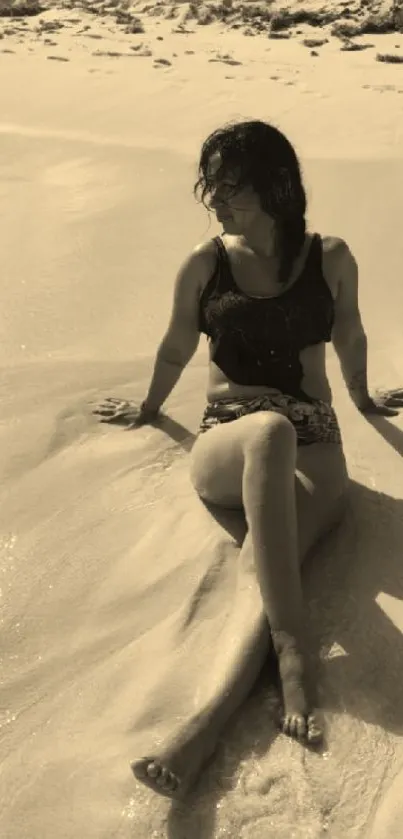 Woman relaxing on a sandy beach in sepia tones, surrounded by calm waves.