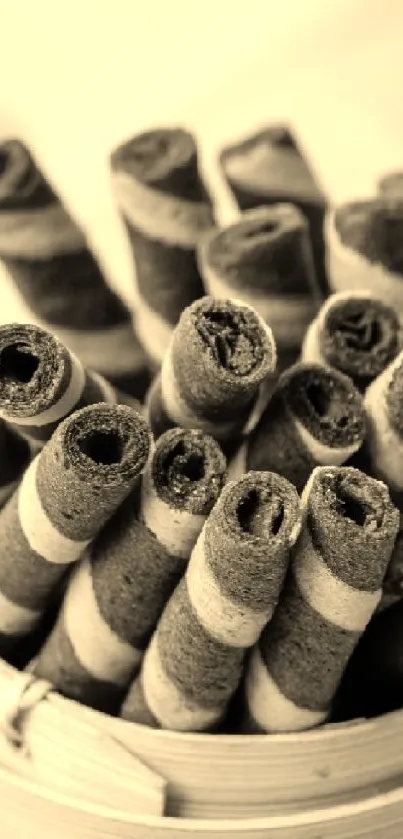 Sepia-toned chocolate wafer rolls in container wallpaper.