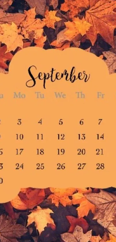 September calendar with autumn leaves background.