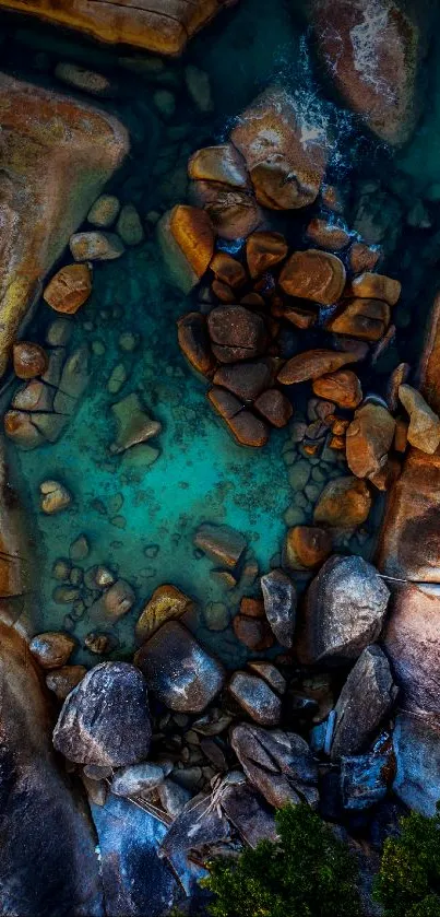 Aerial view of rocky formations and turquoise water, perfect for a serene mobile wallpaper.