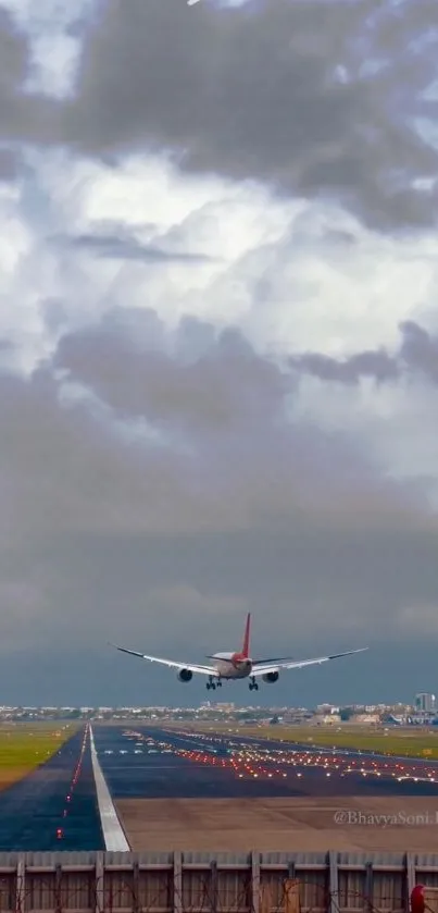 Airplane landing against a cloudy sky on the runway.