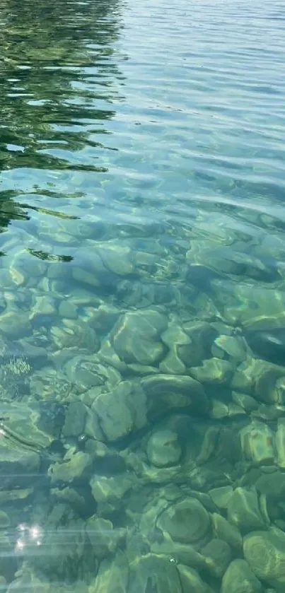 Tranquil clear water with visible underwater rocks.