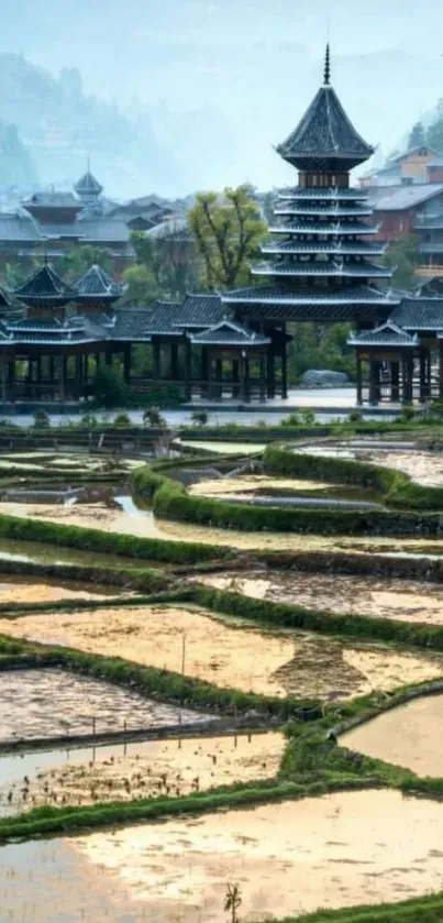 Scenic view of rice terraces with traditional Asian architecture.