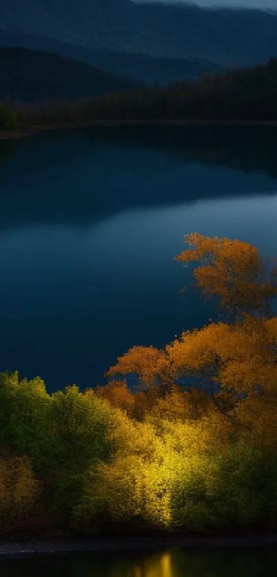 Autumn trees reflected in a serene lake at dusk.