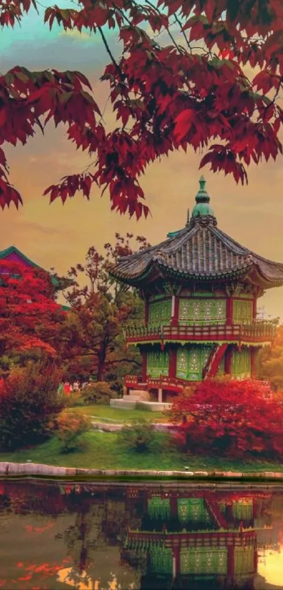 Traditional pavilion with reflection surrounded by autumn foliage.