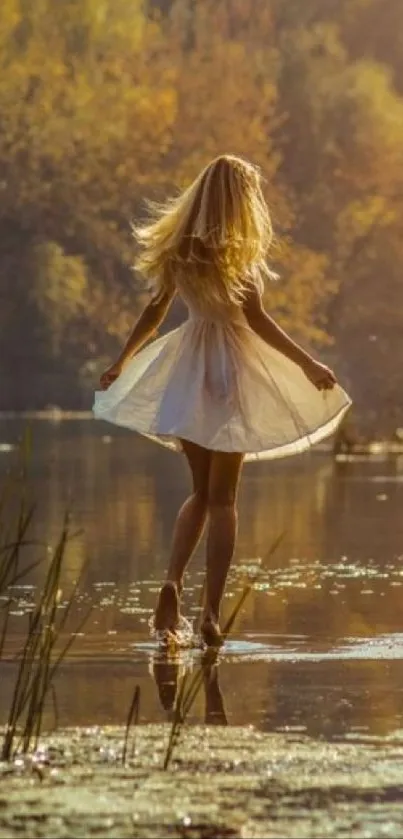 Woman walking in autumn sunlight by a reflective lake.