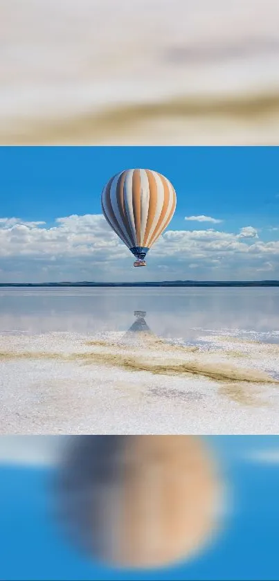 Hot air balloon floats calmly over a serene lake with blue skies and clouds.