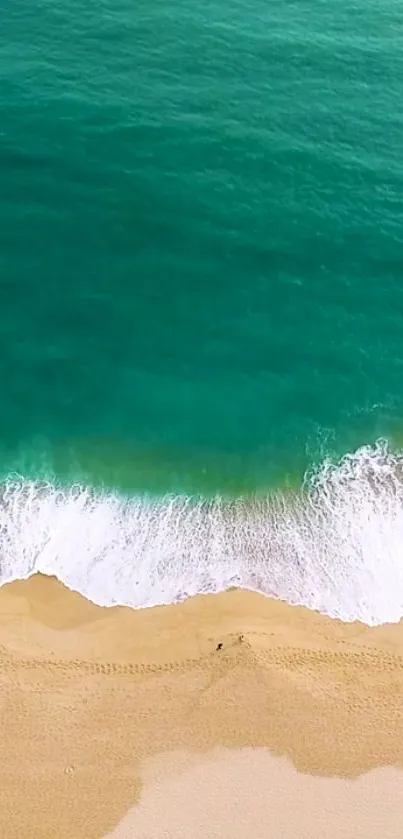 Aerial view of a tranquil beach with turquoise waters and golden sand.