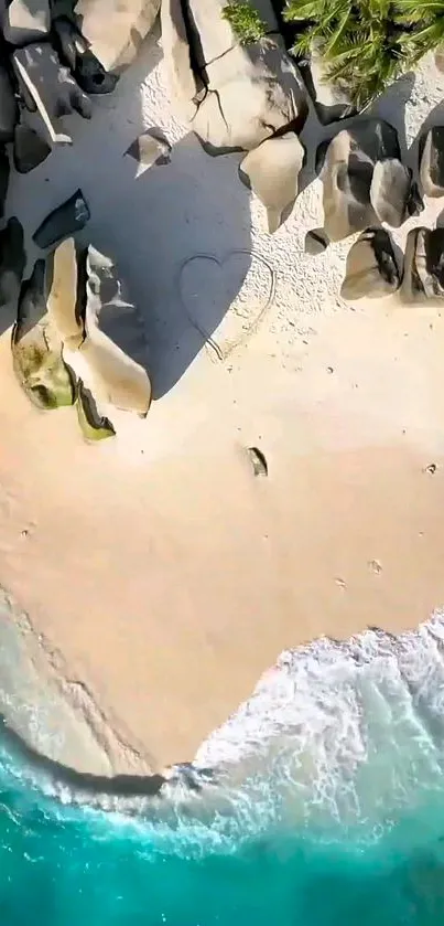 Aerial view of a tranquil beach with turquoise waves hitting the sandy shore.