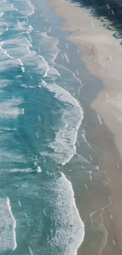 Aerial view of a serene beach with waves and sandy shoreline.