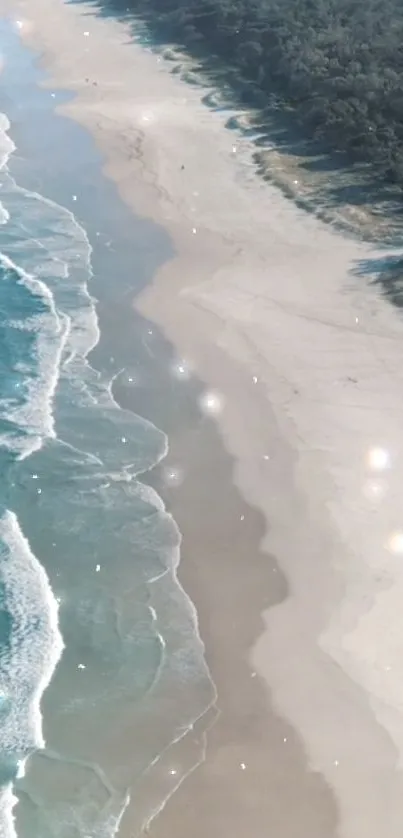 Aerial view of tranquil beach and shimmering ocean waves.