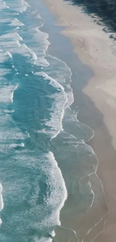 Aerial view of a serene beach with gentle waves and sandy shores.