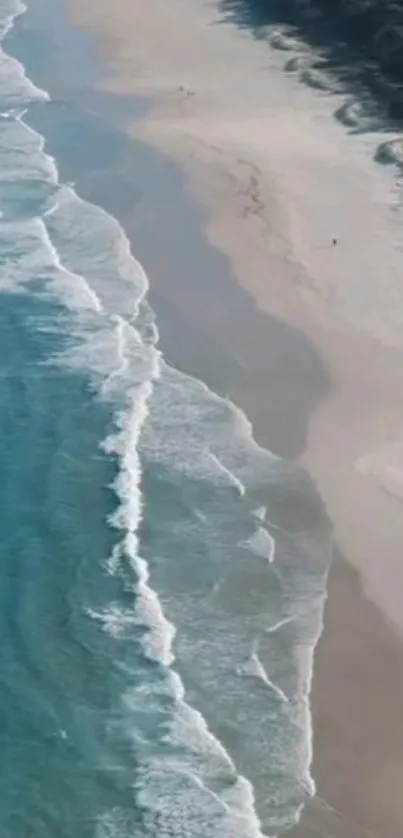 Aerial view of beach with turquoise waves and sandy coastline for mobile wallpaper.