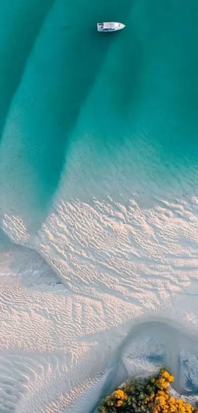 Aerial view of serene beach with teal waters and sandy shores.