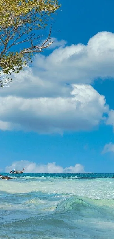 Beach with blue sky, ocean waves, and tree branch wallpaper.