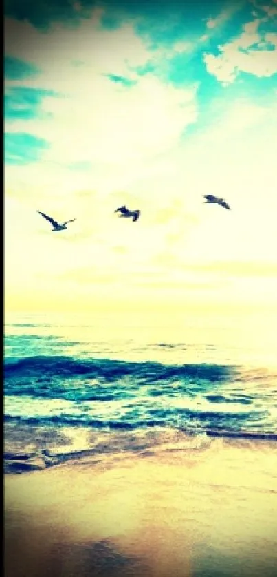 Serene beach with birds gliding over a calm ocean and vibrant sky.