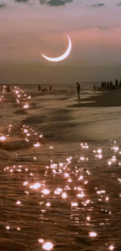 Crescent moon over a sparkling sea at dusk