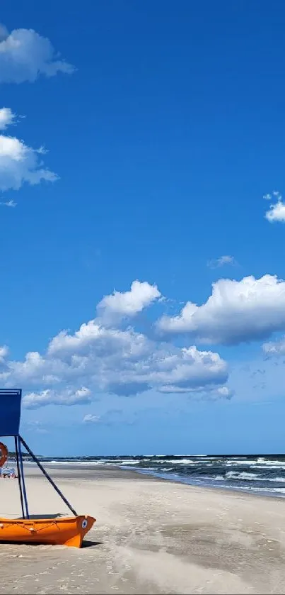 Serene beach with blue sky and lifeguard tower mobile wallpaper.