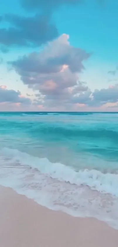 Turquoise ocean beach with soft clouds.