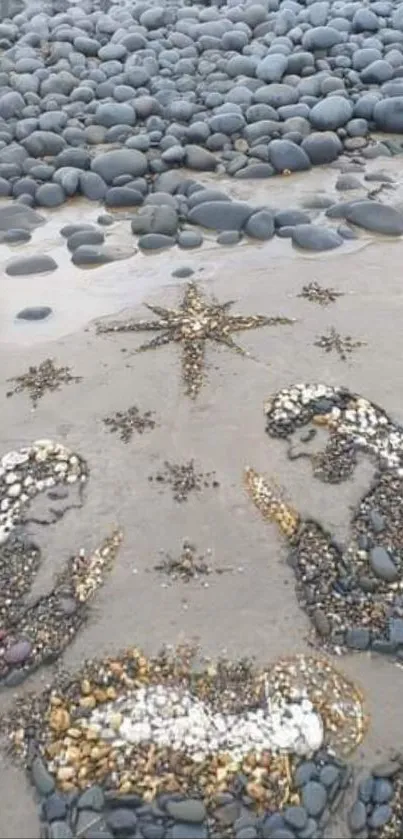 Beach pebble art forming a nativity scene with stones.