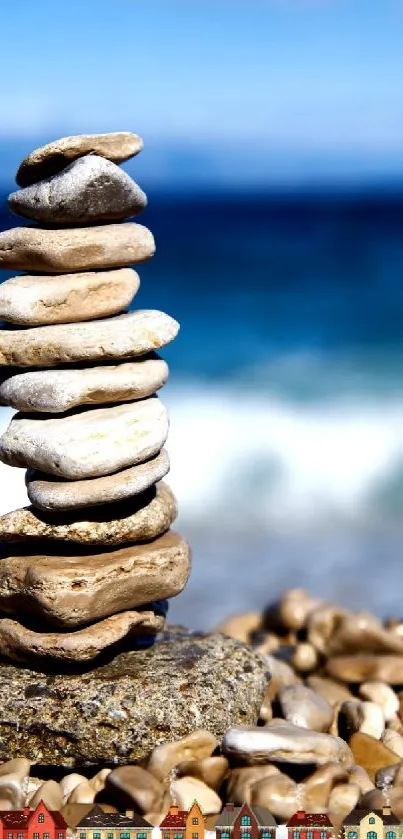 Balanced stack of pebbles on a beach with ocean in the background.