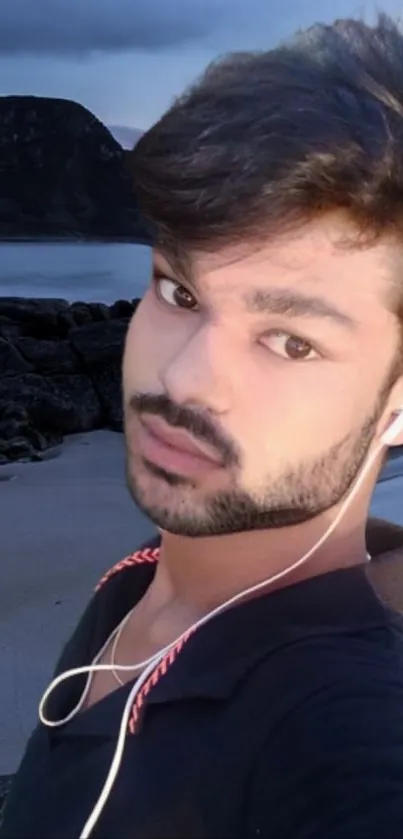 Portrait of a person with serene beach backdrop.