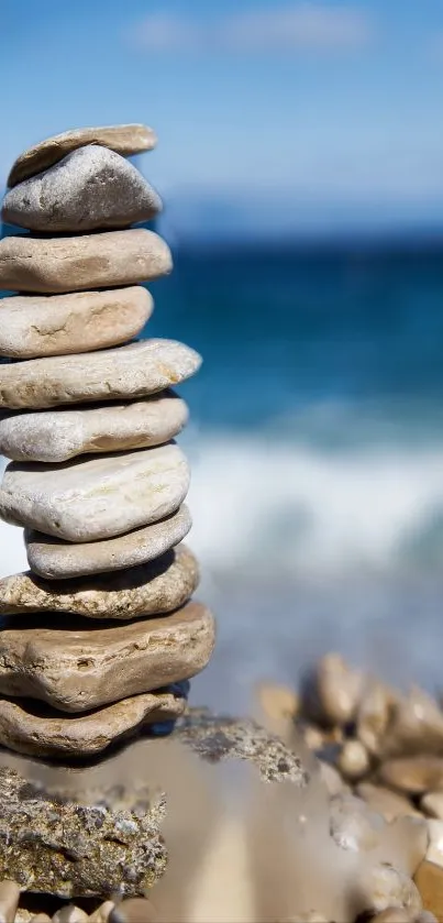 Serene beach scene with stacked stones and ocean backdrop.