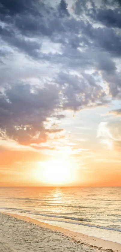 Sunrise over a serene beach with colorful sky and gentle ocean waves.