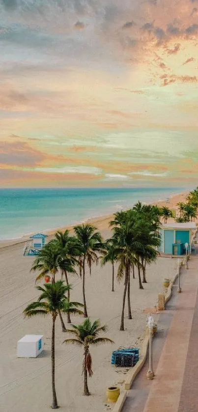 Serene sunset over tropical beach with palm trees and vibrant sky.