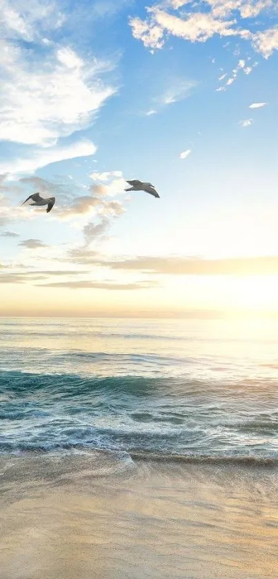 Serene beach at sunrise with birds over ocean.