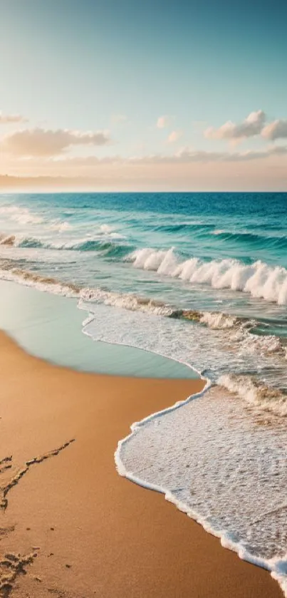 Serene beach at sunset with ocean waves and a colorful sky.