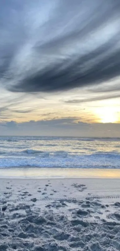 Serene beach sunset with calming ocean waves and a stunning sky.