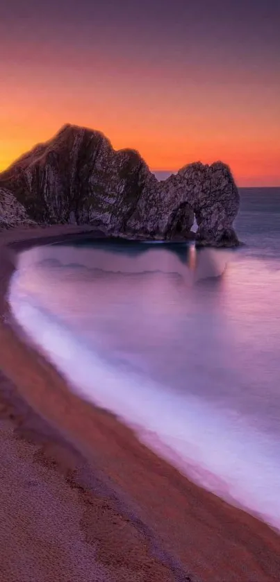 Serene sunset over a rocky beach and ocean.