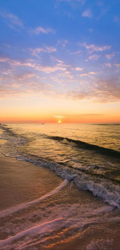 Peaceful sunset over a serene beach with waves and colorful sky.