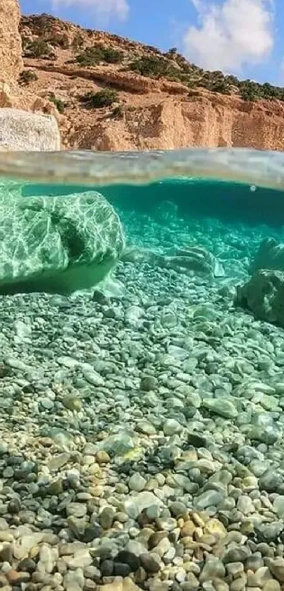 Underwater view of a beach with turquoise waters and pebbles.