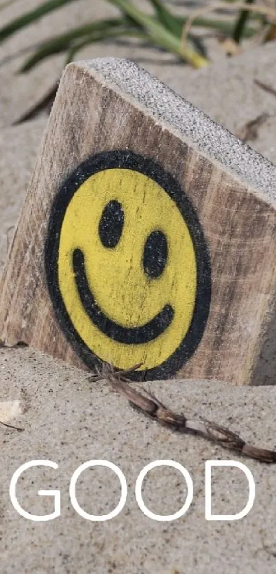 Beach wallpaper with sun and smiley design in sand.