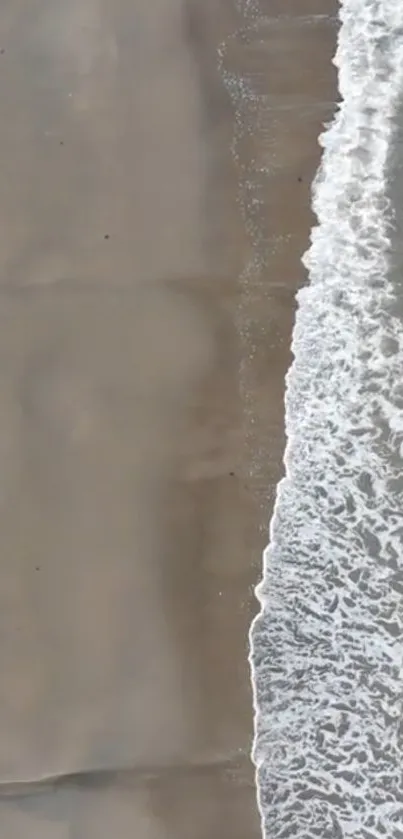 Serene beach with gentle waves along the shoreline.